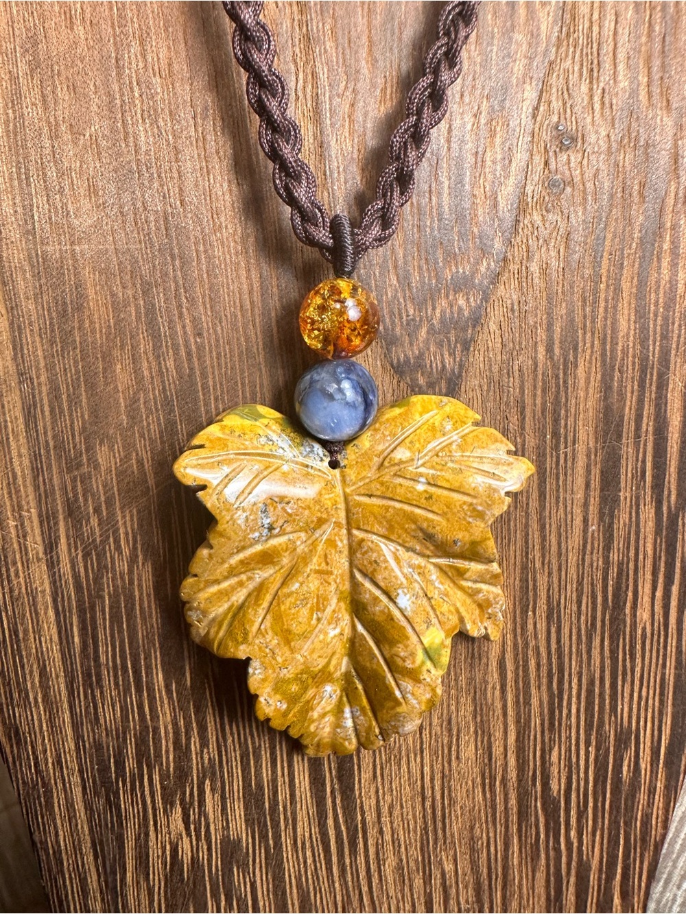 Yellow Ocean Jasper Leaf Carving Pendant Necklace on Brown Braided Rope - Picture 6 of 13